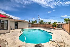 a swimming pool in the middle of a yard at Stylish and Central Mesa Home with Private Pool! in Mesa