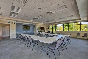 a large conference room with a large table and chairs at Resort-Style Condo with Balcony on Lake Keowee in Salem +35 photos