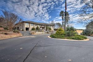 an empty road in front of a house with a flag at Resort-Style Condo with Balcony on Lake Keowee in Salem
