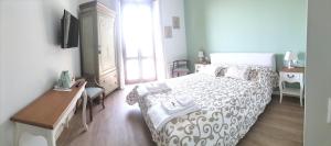 A bed or beds in a room at Al Giardino Segreto
