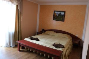 Postel nebo postele na pokoji v ubytování Готель ***ФЕЄРІЯ + 37 fotografií