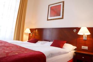 Letto o letti in una camera di Hotel Grand
