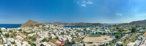 an aerial view of a town on a mountain at Iliolousto Studios in Skala