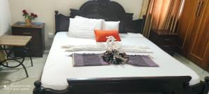 a bed with towels and a swan on it at TEVAH SUITES in Mombasa