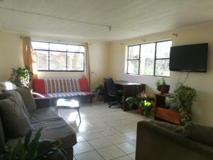 Posezení v ubytování Camping & Hospedaje Rio Laja