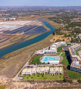 an aerial view of a resort next to a river at AP Cabanas Beach & Nature - Adults Friendly in Cabanas de Tavira