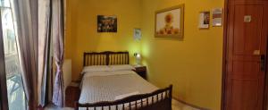 Postel nebo postele na pokoji v ubytování Complesso turistico Aurora - camere B&B