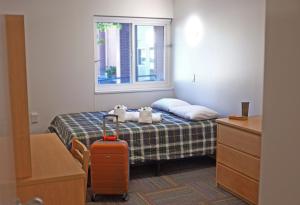 Postelja oz. postelje v sobi nastanitve UBC Okanagan Campus