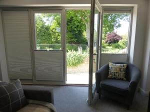A seating area at The Stone Barn at Stratton House 