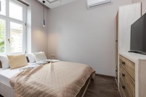 Katil atau katil-katil dalam bilik di InshiApartments on Kovzhuna str