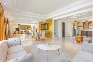 a living room with a couch and a table at Luxury Mansion Rhodes in Ialyssos