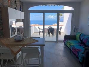 a living room with a couch and a table at Costa Adeje Apartments in Adeje