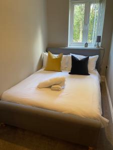 Un pat sau paturi într-o cameră la Gadslodge