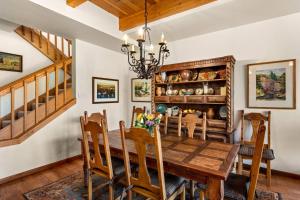 a dining room with a wooden table and chairs at Ridge 27 in Snowmass Village