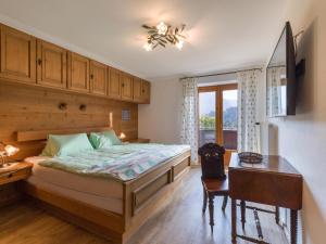 Ένα ή περισσότερα κρεβάτια σε δωμάτιο στο Exclusive Villa Tirol