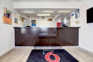 a welcome mat in a waiting room at a wyncote office at Motel 6-Grants, NM in Grants