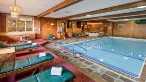 a large swimming pool in a room at Best Western Adirondack Inn in Lake Placid