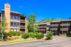 a row of apartment buildings with a parking lot at Lodge at Steamboat C301 in Steamboat Springs