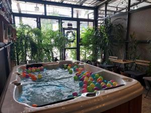 a large pool of water with balls in it at Super nice townhouse in city center, 10 minutes walk to beach, night market ... in Hua Hin