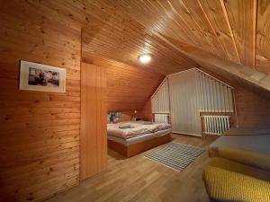 A bed or beds in a room at Apartmán na hranici