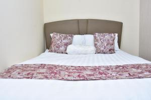 מיטה או מיטות בחדר ב-Amber Apartments G1 Kitengela