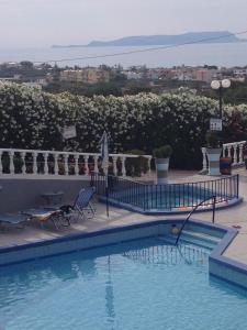 a swimming pool with a water slide at Villa Marina in Hersonissos