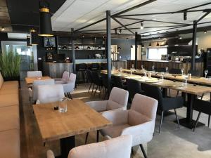 A restaurant or other place to eat at Primma Hotel