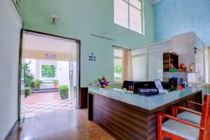 a kitchen with a counter in a room at Brindavan Garden Resort & Spa in Mysore