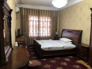 Posteľ alebo postele v izbe v ubytovaní Hello Dushanbe Guest House