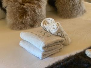 a pile of towels sitting on top of a table at Micro-lodge, Jardin Secret in Montriond +83 photos