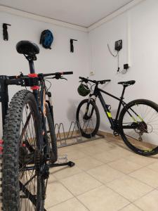 two bikes parked next to each other in a room at Esperos Suites & Villas in Lafkos