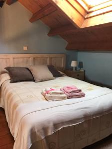 Łóżko lub łóżka w pokoju w obiekcie La Casuca