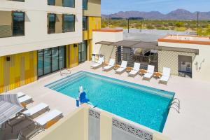 a swimming pool on the roof of a building at Hyatt House North Scottsdale in Scottsdale