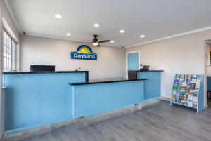 a view of the front desk of addsim store at Days Inn by Wyndham Red Bluff in Red Bluff +37 photos