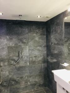 a bathroom with a shower and a sink at Bed@BroadOak in Sturminster Newton