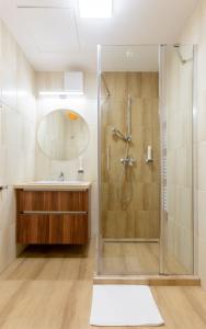 a bathroom with a shower and a sink at Hostel Mayer Superior Veszprém in Veszprém