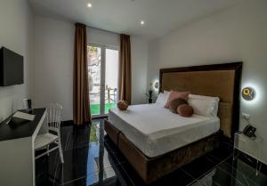 TV a/nebo společenská místnost v ubytování GRAND HOTEL SERAPIDE