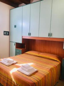 Cama o camas de una habitación en Michelangelo Holiday & Family Resort