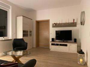 TV a/nebo společenská místnost v ubytování Modern Home Check-in & chill down auf 65 qm²