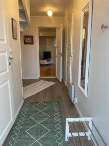 a hallway with a door leading to a living room at Panorama Vardø in Vardø