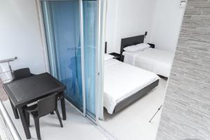 Postel nebo postele na pokoji v ubytování Hotel Cayapo