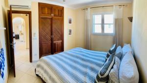 Ein Bett oder Betten in einem Zimmer der Unterkunft Sa Rapita Es-Trenc Ferienhäuser