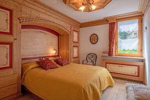 Giường trong phòng chung tại Apartment center Madonna di Campiglio AF