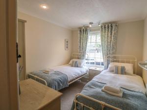 Voodi või voodid majutusasutuse Olde Carpenters Cottage toas