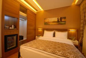 Postel nebo postele na pokoji v ubytování Imamoglu Pasa Butik Hotel