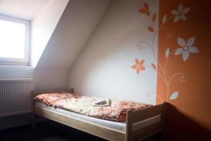 Postel nebo postele na pokoji v ubytování Althanský hostinec
