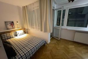 Posteľ alebo postele v izbe v ubytovaní Super Apartament SAWA 2 Metro WiFi 500 mbs TV'50 Netflix HBO AppleTV+