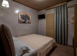 Postel nebo postele na pokoji v ubytování Hotel Meteora