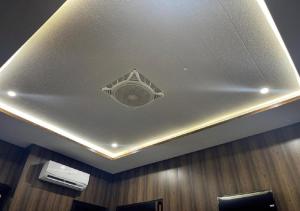 a ceiling with a vent in the middle of a room at Oriole Guest House Economy Living in Islamabad