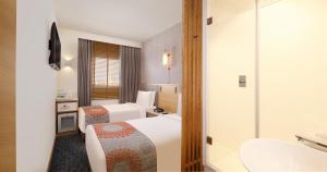 Ein Bett oder Betten in einem Zimmer der Unterkunft Holiday Inn Express Chennai OMR Thoraipakkam by IHG
